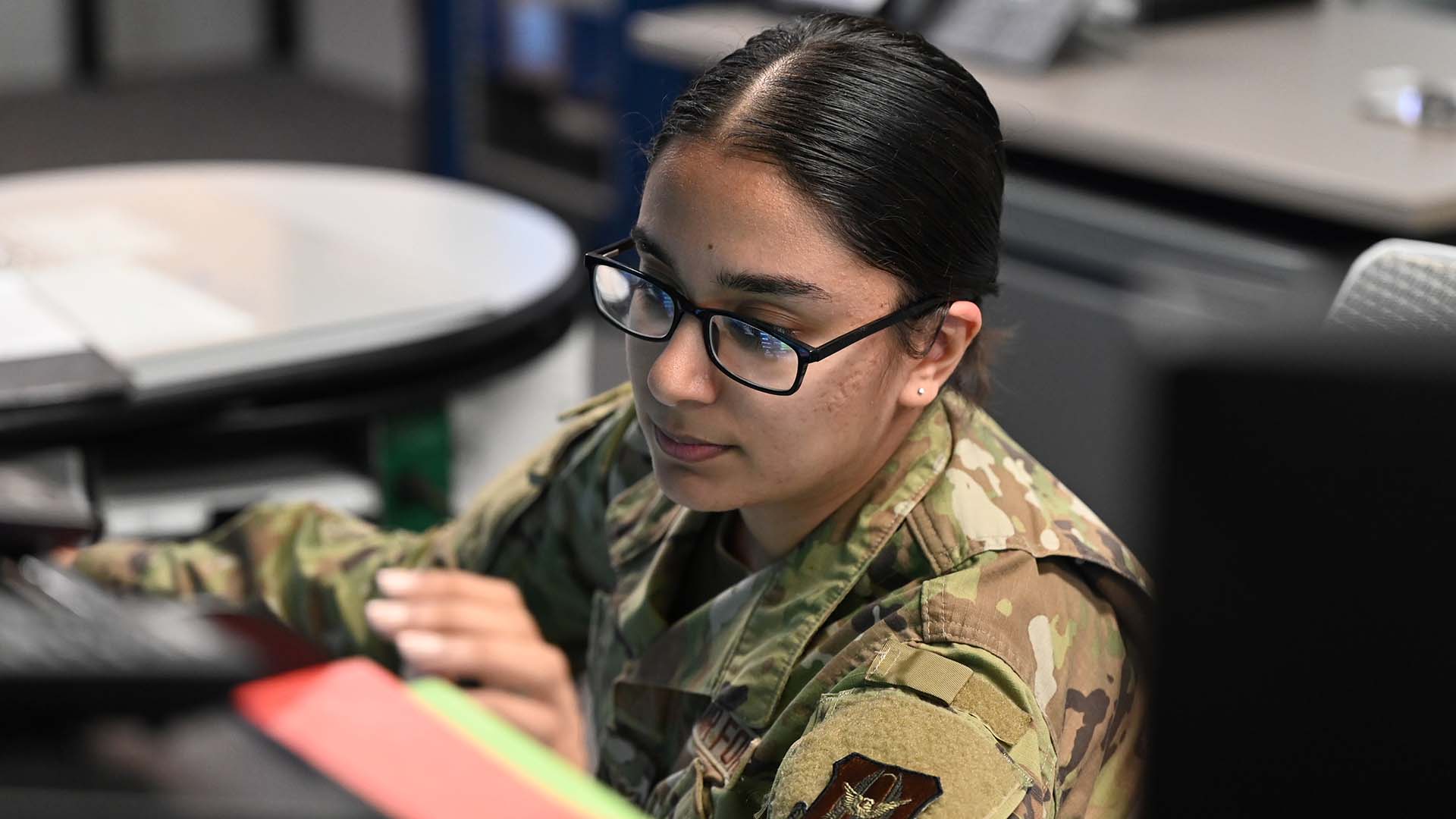 service member at desk